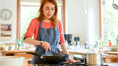 Lady cooking in her kitchen