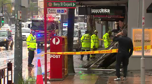 In Neutral Bay, the downpour was so heavy, a shop awning collapsed onto the footpath.