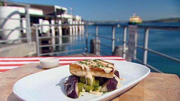 Char-grilled swordfish with steamed marinated egg plant, pesto potatoes and truffle dressing