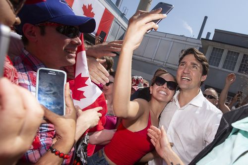 Canadian prime minister Justin Trudeau was attending a Canada Day event when he was asked to address allegations he groped a female reporter at a music festival in 2000  (Geoff Robins/The Canadian Press via AP).
