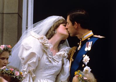 The newly married Prince and Princess of Wales (formerly Lady Diana Spencer) kiss on the balcony of Buckingham Palace after their wedding ceremony at St. Paul's cathedral. 29-Jul-1981