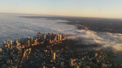 Fog rolled in over Sydney this morning, almost completely cloaking the Harbour Bridge. (Lee Jones)