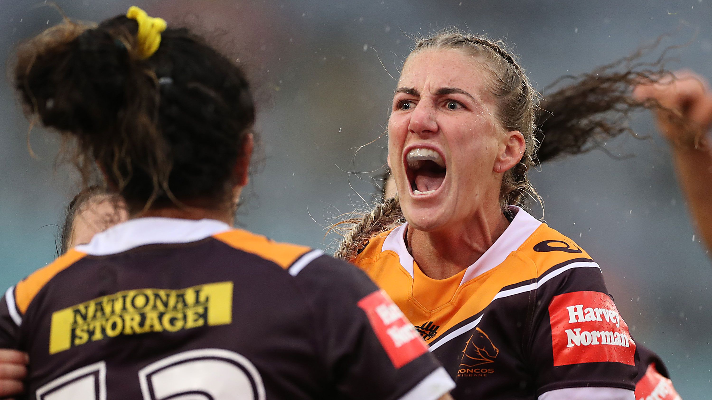 Ali Brigginshaw of the Broncos is congratulated by teammates after a try scored by Tallisha Harden in the 2020 NRLW grand final.