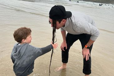 Princess Eugenie shared this snap of son August playing with husband Jack Brooksbank by the sea.