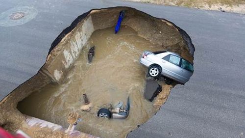 Deputy sheriff killed after car swallowed by sewage sinkhole