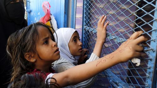 Conflict-affected Yemenis wait to receive free bread by a local charity bakery amid a severe shortage of food in Sana'a, Yemen, in April 2019. According to reports, nearly 20 million people of Yemen's 26-million population are in need of urgent humanitarian assistance as a result of increased food insecurity, including 10 million people on the brink of famine.