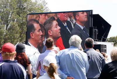 The grief was felt around Australia, mourners watch the ceremony in Adelaide.