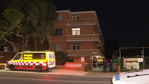 The woman fell three storeys before hitting the driveway of the Cabramatta apartment block.