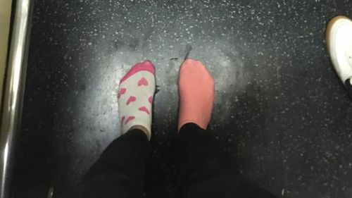 Kay Brown, 26, rode the rest of the train ride home in her odd socks. (Facebook)