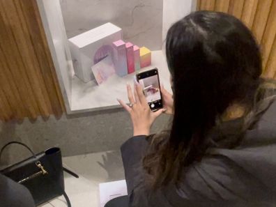 Cindy Lim snaps a photo of Koko&Kush products in store.