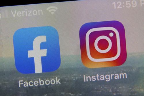 A view of the mobile phone app logos for, from left, Facebook and Instagram in New York, Oct. 5, 2021.