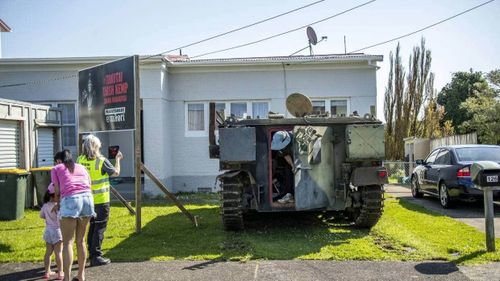 The armoured vehicle has pride of place on the front yard.