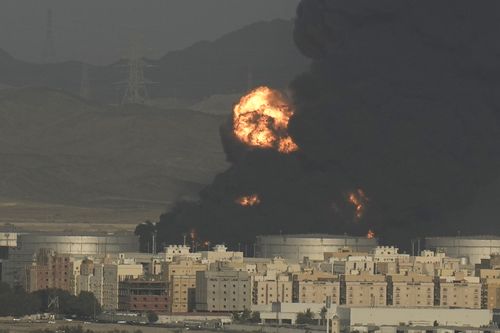 A cloud of smoke rises from a burning oil depot  in Jiddah, Saudi Arabia, Friday, March 25, 2022 
