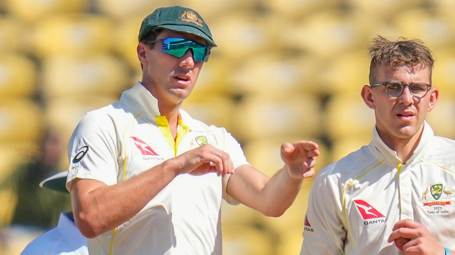 Australia&#x27;s captain Pat Cummins, left, adjusts fielding as Todd Murphy watches during the third day of the first cricket test match between India and Australia in Nagpur, India, Saturday, Feb. 11, 2023. (AP Photo/Rafiq Maqbool)