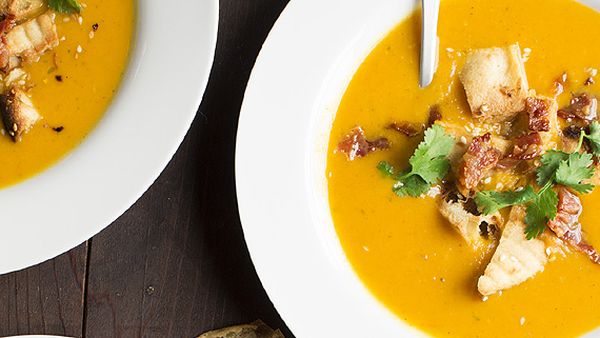 Korma and butternut soup with crispy bacon and sesame naan croutons