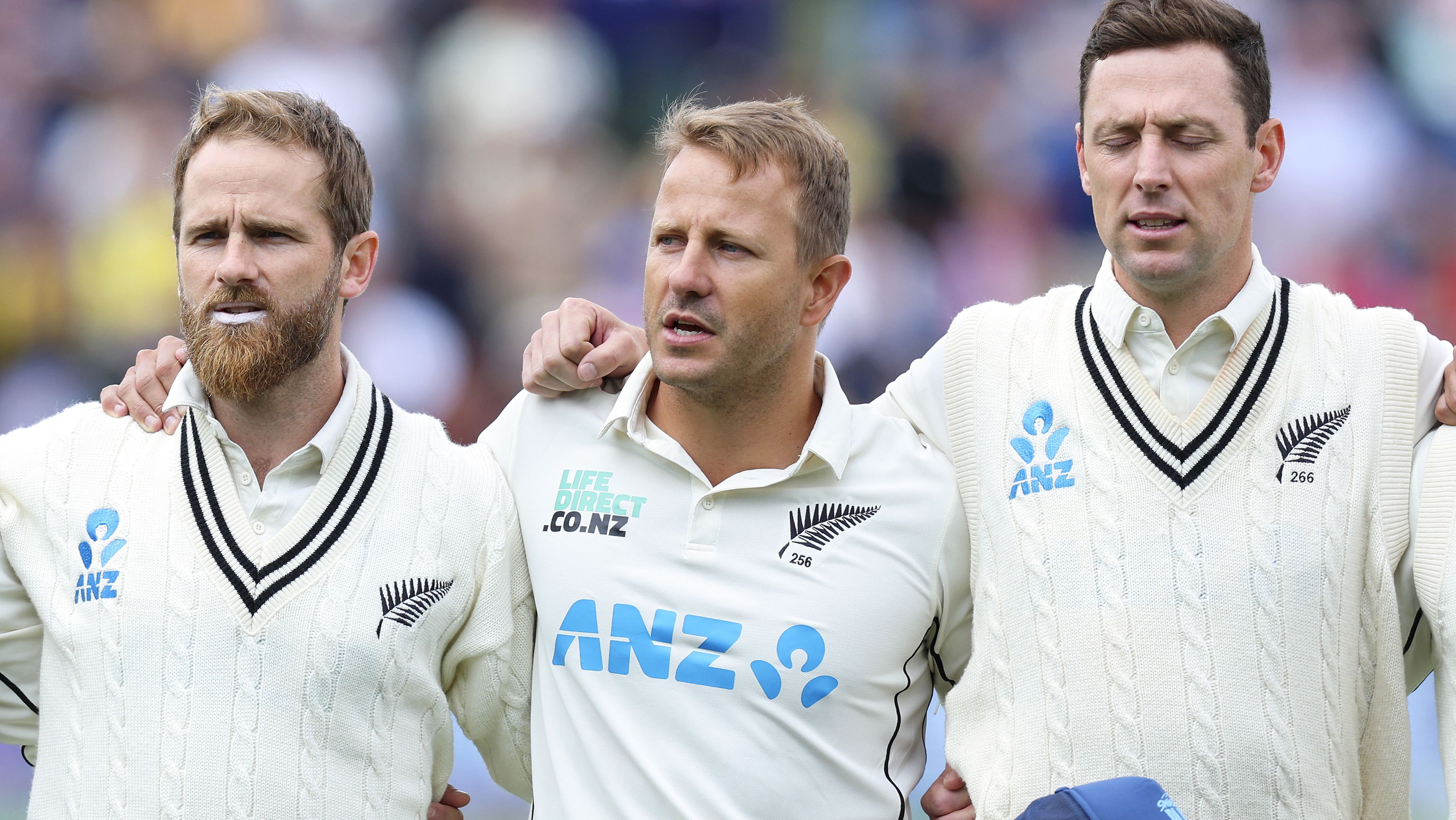 Kane Williamson (from left), Neil Wagner and Matt Henry of New Zealand sing the national anthem during day one of the first Test in Wellington.