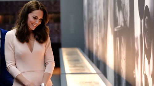 The Duchess of Cambridge then viewed portraits of herself, which were taken for Vogue. (Twitter / @KensingtonRoyal)