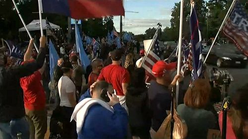 Large crowds of Trump supporters have gathered outside the military hospital where Donald Trump has been treated for coronavirus.