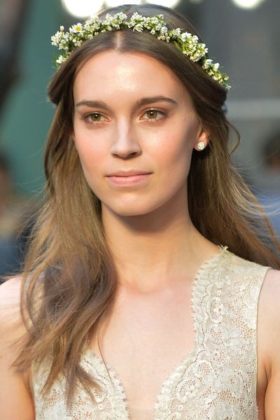 A
delicate flower crown was placed over models' waves at Monique Lhullier.