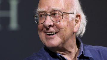 Britain&#x27;s Professor Peter Higgs smiles during a press conference in Edinburgh, Scotland, on October 11, 2013.  