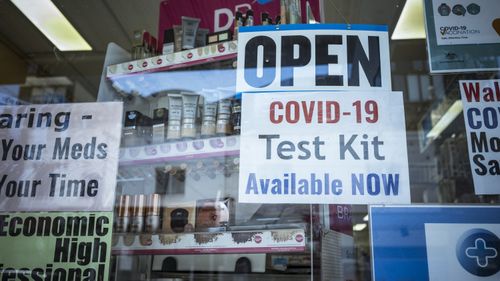 A Brunswick is displaying a sign showing they have supply of Rapid Antigen Test kits in Melbourne.