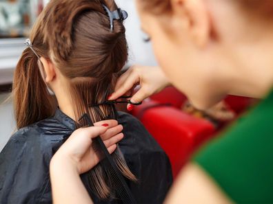 Girl getting hair cut short