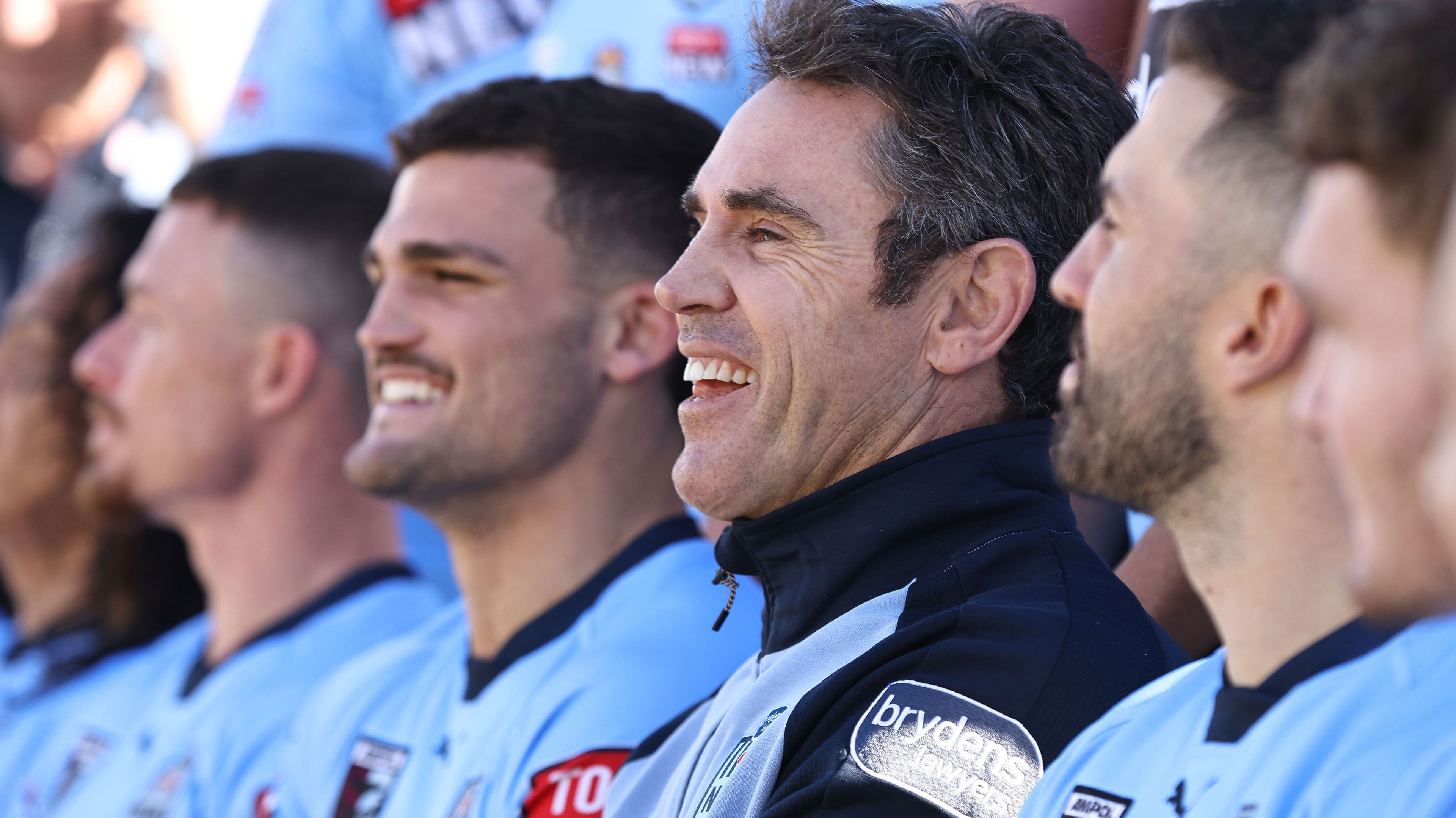 Brad Fittler looks on while waiting for the NSW team photo to be taken. 