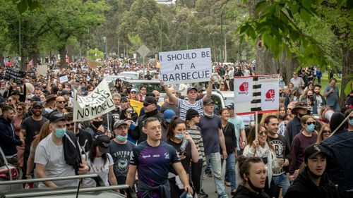 The large crowd begins to march on October 23, 2020 in Melbourne, Australia