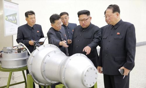 North Korea officials including Kim Jong-Un inspect the newly built mini hydrogen bombs. (Reuters/KCNA)