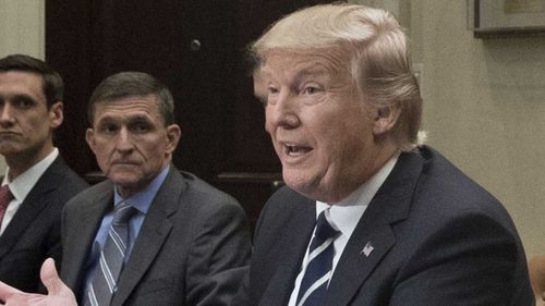 Mike Flynn with Donald Trump two days after the president found out about his phone call to the Russians. (AP)