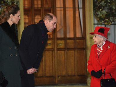 The Queen and Prince William meet in the quandrangle at Windsor Castle. 