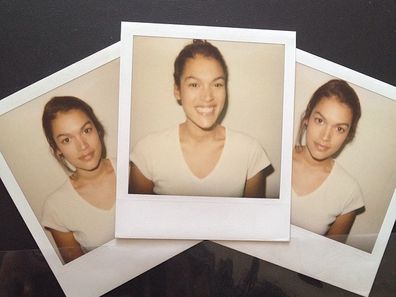 Jennifer Atile?mile smiles in her first modelling polaroids.