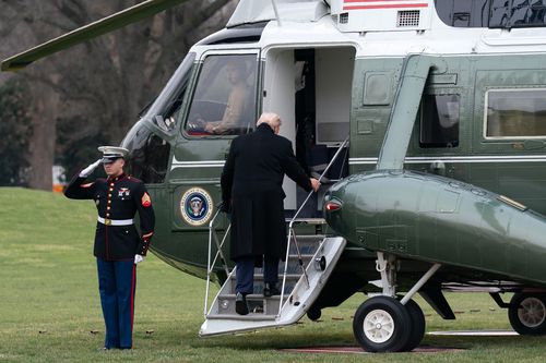 President Donald Trump boards Marine One as he departs from the South Lawn of the White House, Saturday, Dec. 13, 2025, in Washington, en route to Baltimore to attend the Army-Navy football game. (AP Photo/Jose Luis Magana)