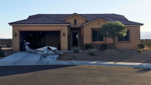 This non-descript home is where the couple lives and the gun haul was found.