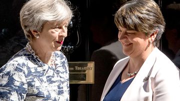 Prime Minister Theresa May greets DUP leader Arlene Foster outside 10 Downing Street in London. (AAP)