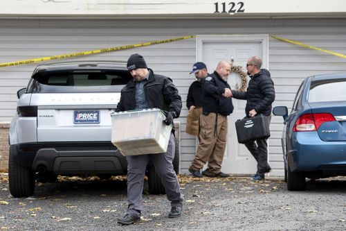 Officers investigate the deaths of four University of Idaho students at an apartment complex south of campus on Monday, November 14, 2022, in Moscow, Idaho. 