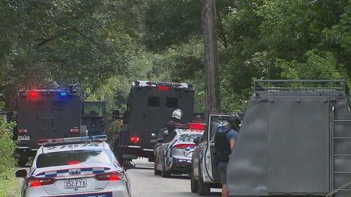 Police have declared an emergency as officers remain in a tense stand-off with a suspected gunman on the Gold Coast.