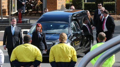 Peter Beilby (centre, right), the father of slain Brisbane teenager Larissa Beilby, walks behind his daughter's hearse during a ceremony at Lakeview Chapel. Picture: AAP