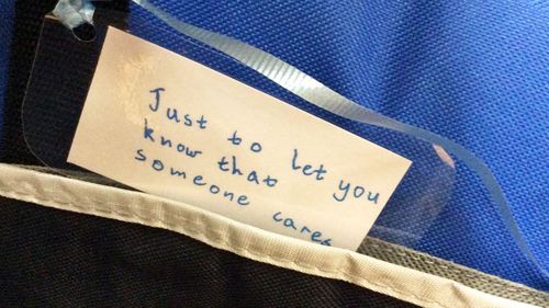 A handwritten tag on one of Vincent's care packages.