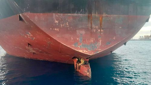 Three men were rescued from the rudder of an oil tanker after spending 11 days crossing the Atlantic Ocean.