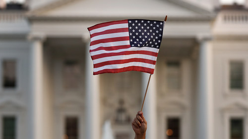 File photo:  An American flag is waved during a rally outside the White House, in Washington, Monday, Sept. 4, 2017. (AP Photo/Carolyn Kaster)