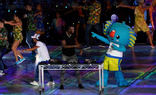 Usain Bolt hits the decks with Borobi. (AAP)