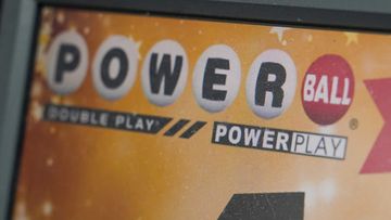 A display panel advertises tickets for a Powerball draw at a convenience store in the United States.