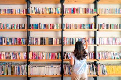 Woman in library. Books