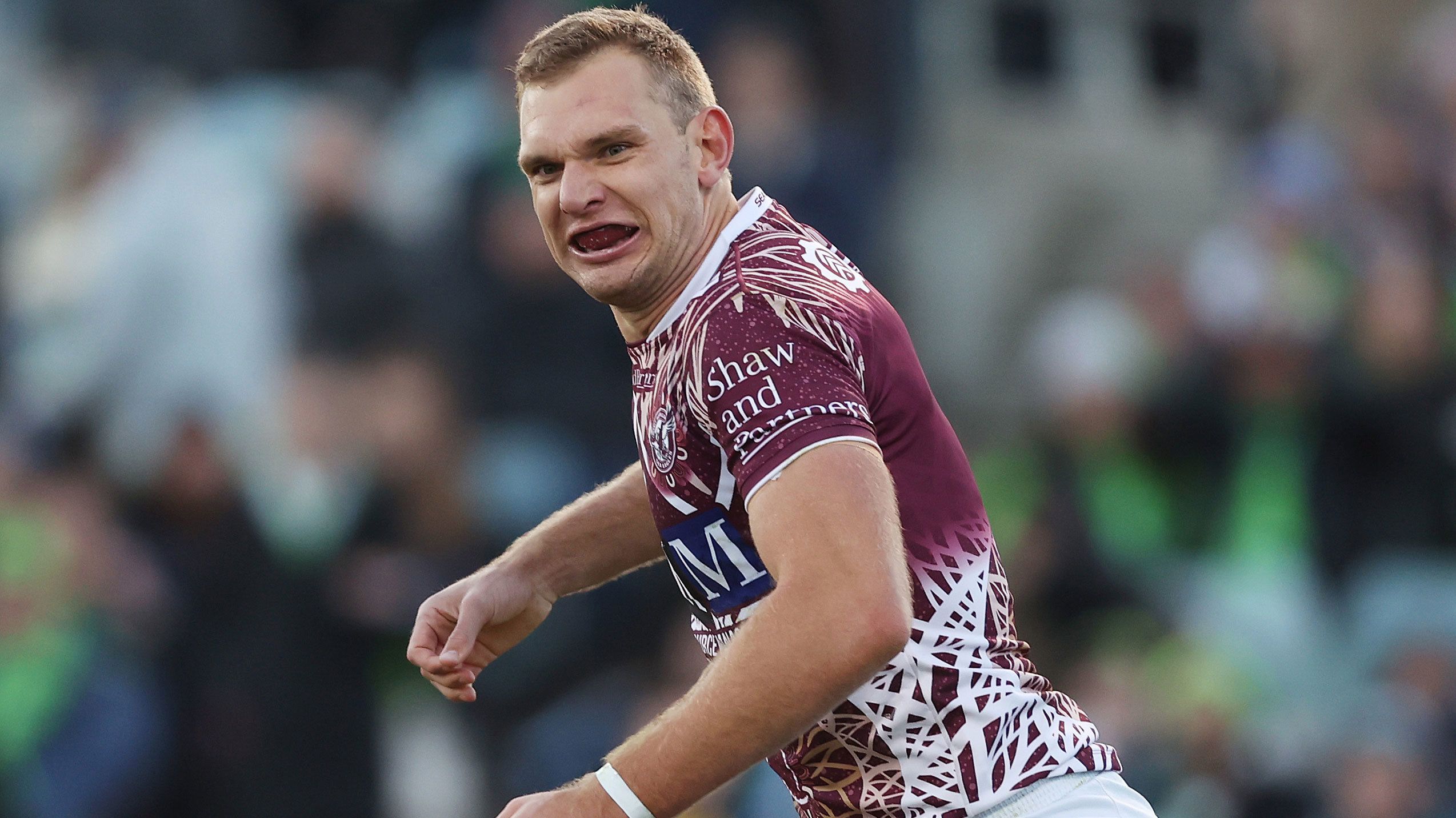 Tom Trbojevic celebrates after scoring a try in Manly&#x27;s round 12 match against the Raiders.