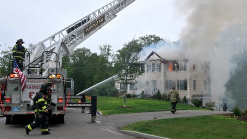 Three dead after light plane crashes into US house