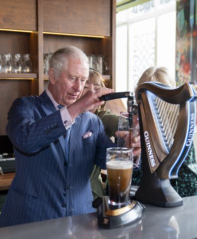 Prince Charles pours a pint of Guinness during a visit with The Duchess of Cornwall to the Irish Cultural Centre to celebrate the Centre's 25th anniversary in the run-up to St Patrick's Day