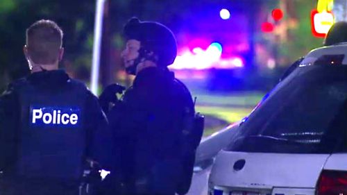 Police arrest man after alleged armed stand-off in Melbourne home while children slept