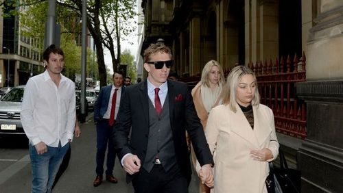 Richard Vincec (centre) arrives to his plea hearing at the Supreme Court in Melbourne.