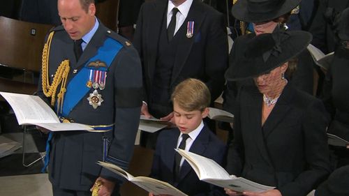 Prince William, Catherine, Princess of Wales, and their eldest son George who is now second in line for the throne.